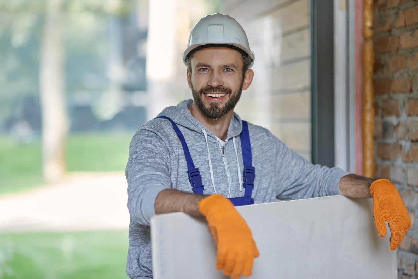 portrait-of-handsome-young-male-builder-in-hard-hat-looking-positive.jpg